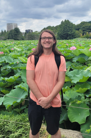 A picture of me next to a pond full of lilies in Ueno Park, Tokyo, Japan (July 2023)